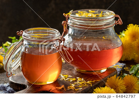 Dandelion honey - syrup made from fresh dandelion flowers 64842797