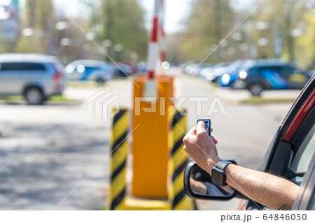 lifting barrier at the exit to the parking lot by remote control 64846050