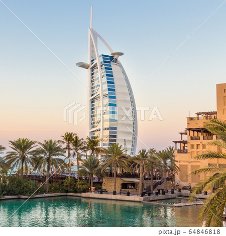 Dubai landmark, seven star luxury hotel Burj Al Arab at dusk, UAE 64846818