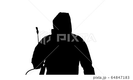 Silhouette Virologist in protective uniform walking and disinfecting the area. Silhouette Virologist in protective uniform walking and disinfecting the area. 64847183