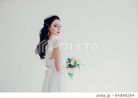 Princess with a Crown in white dress the bride 64848264