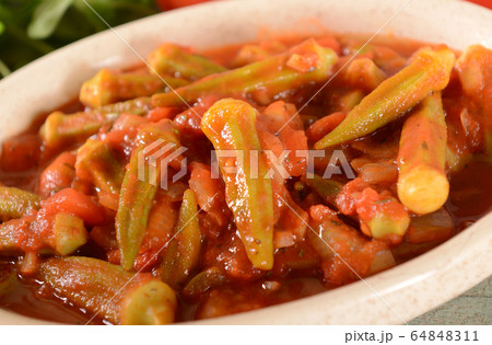 Okra dish with tomatoes 64848311