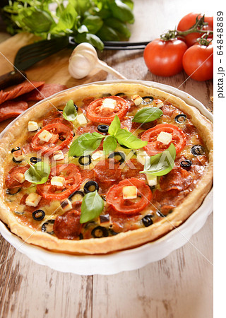Tart (Quiche) with tomatoes, basil, salami, black 64848889