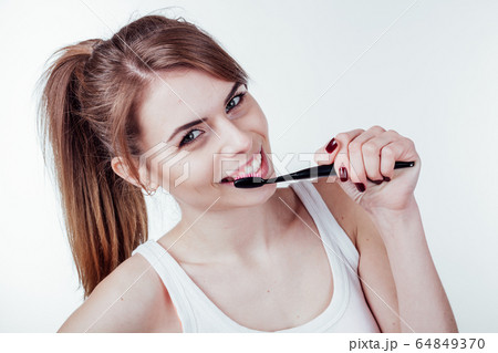 beautiful girl cleans white teeth toothbrush smile 64849370