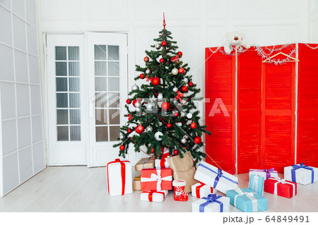 Christmas white room interior with gifts for the new year as a background 64849491