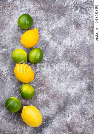 Fresh ripe limes and lemons 64850399