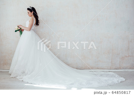 Portrait of bride wedding dress Crown curls hairstyle 64850817