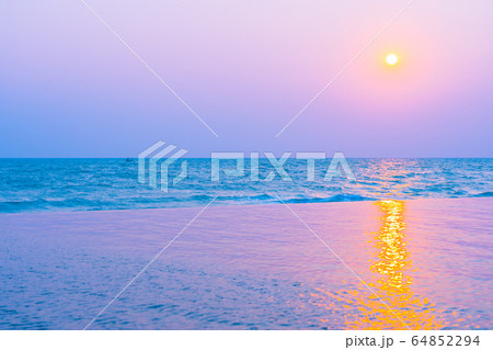 Beautiful tropical nature of sea ocean beach around outdoor swimming pool at sunset or sunrise time Beautiful tropical nature of sea ocean beach around outdoor swimming pool at sunset or sunrise time 64852294