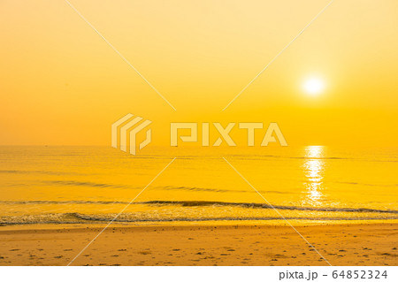 Beautiful tropical sea ocean beach at sunrise or sunset time 64852324