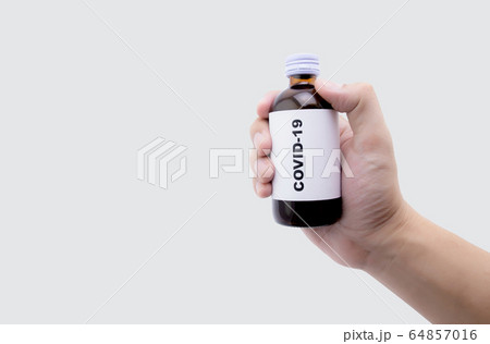 Hand holding sample medicine of covid-19, coronavirus outbreak with pandemic 64857016