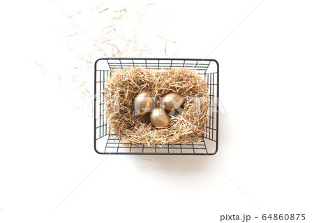 Top view of an iron mesh basket with a nest. Nordic style 64860875