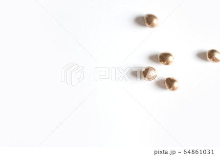 A few small golden eggs. White background. 64861031