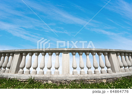 White balustrade on blue sky with clouds and copy space 64864776