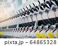 Textile Manufacturing. Circular knitted fabric. Textile factory in spinning production line and a rotating machinery and equipment production company. Clothing industry. Manufacturing textile fabrics. 64865328