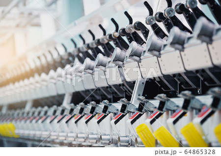 Textile Manufacturing. Circular knitted fabric. Textile factory in spinning production line and a rotating machinery and equipment production company. Clothing industry. Manufacturing textile fabrics. 64865328