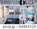 Textile Indusrty. Circular knitted fabric. Textile factory in spinning production line and a rotating machinery. 64865329