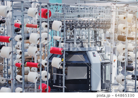 Textile Manufacturing. Circular knitted fabric. Textile factory in spinning production line and a rotating machinery and equipment production company. Clothing industry. Manufacturing textile fabrics. 64865330
