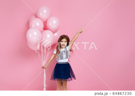 child girl posing with pastel pink air balloons child girl posing with pastel pink air balloons 64867230