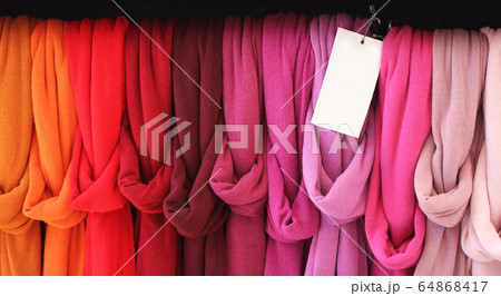 Close-up Collection of colorful shade hand made cotton scarves with empty price tag at opened christmas market in Europe, Advertisement backgrounds at souvenir giftshop, Close-up Collection of colorful shade hand made cotton scarves with empty price tag at opened christmas market in Europe, Advertisement backgrounds at souvenir giftshop, 64868417