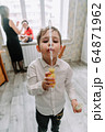 Child playing with soap bubbles in the home 64871962