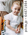 Happy loving family. Mother combs her daughter's hair 64871984