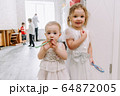 two little girls at a children's birthday party 64872005