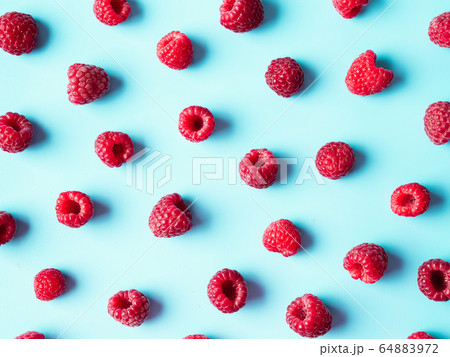 Raspberry pattern, blue background, top view 64883972