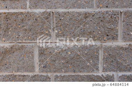 Grey brick wall. Block background, design pattern 64884114