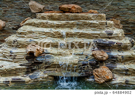 A beautiful waterfall in the park A beautiful waterfall in the park 64884902