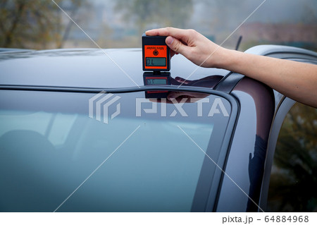 Measuring the thickness of the car paint coating 64884968