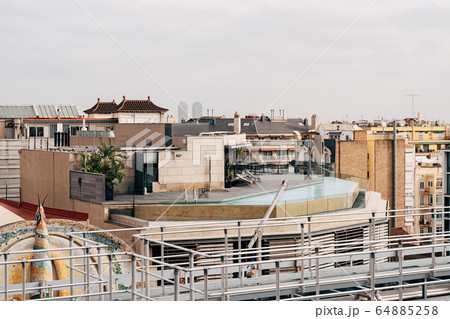 Rooftop pool. View from a nearby building onto the roof of the house on which the pool is located. Rooftop pool. View from a nearby building onto the roof of the house on which the pool is located. 64885258