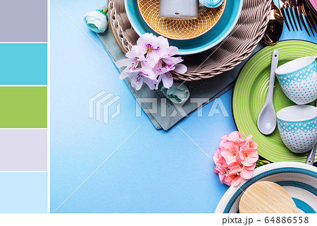Tableware dish set on blue pastel background. Color swatch Tableware dish set on blue pastel background. Color swatch 64886558