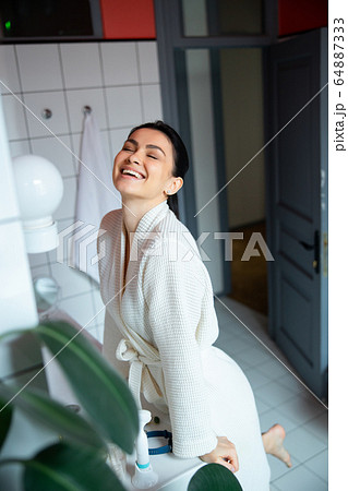 Woman in bathroom having fun stock photo Woman in bathroom having fun stock photo 64887333