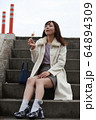 美人大阪人女性の食べ歩きモデル写真: みたらし団子編 64894309