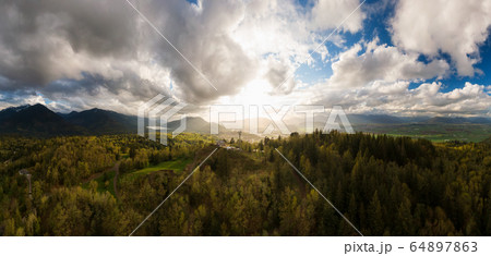 Aerial Panoramic View of Mt. Thom during a colorful cloudy evening Aerial Panoramic View of Mt. Thom during a colorful cloudy evening 64897863