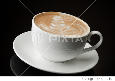 cup of coffee on a dark background 64899410