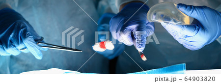 Surgeons at plastic surgery Surgeons at plastic surgery 64903820