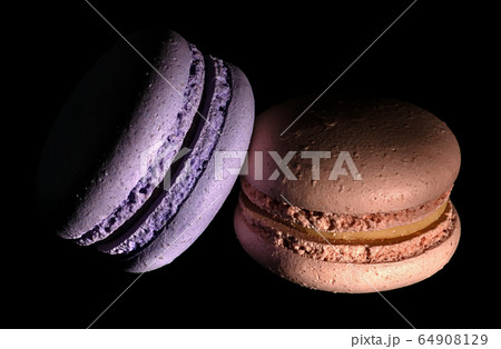 Two macaroons darkened in black 64908129
