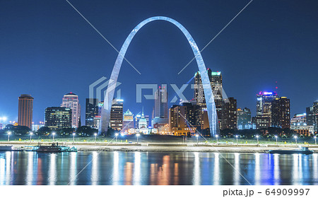 st. louis skyscraper at night with reflection in river. st. louis skyscraper at night with reflection in river. 64909997