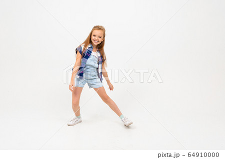 attractive european girl jumping on a white wall attractive european girl jumping on a white wall 64910000