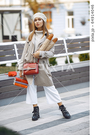 Wowan in a white beret in a city with a baguette 64914046