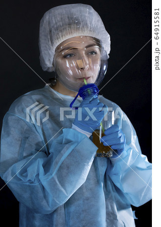 Young woman in protective clothing. On the face of 64915581