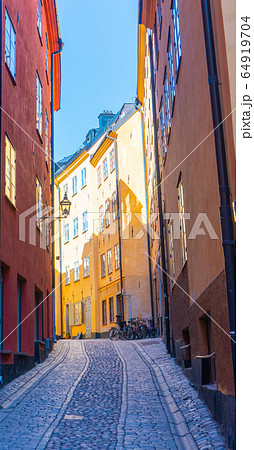 Narrow street in Stockholm. The old town (gamla stan) of the Swedish capital. Narrow street in Stockholm. The old town (gamla stan) of the Swedish capital. 64919704