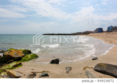 Beach and sea in bright sunlight 64919872
