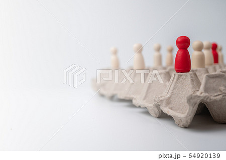 A wooden figure standing with team to influence A wooden figure standing with team to influence 64920139