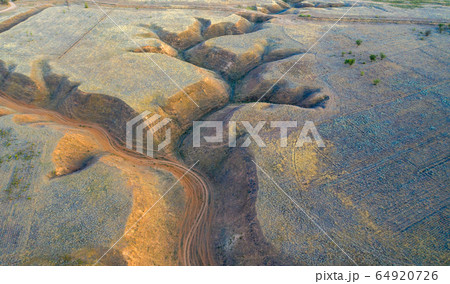 Soil erosion in the steppe zone of the Caspian lowland. Aerial view. 64920726