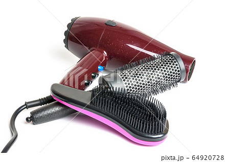 Hair dryer and hairbrushes isolated on white. Hair dryer and hairbrushes isolated on white. 64920728
