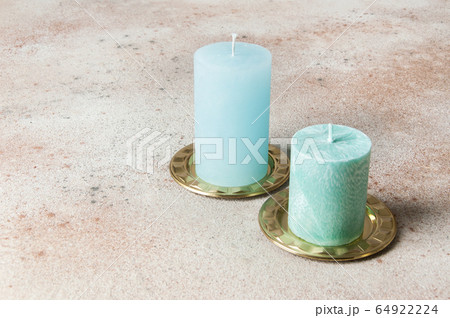 Blue candles on brass candlesticks, coasters Blue candles on brass candlesticks, coasters 64922224