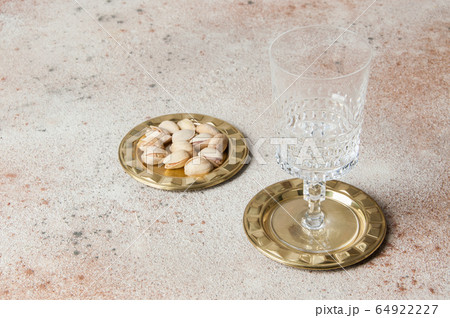 Antique brass coasters, small dish on concrete Antique brass coasters, small dish on concrete 64922227