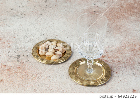Antique brass coasters, small dish on concrete Antique brass coasters, small dish on concrete 64922229